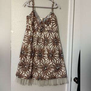 100% Silk Sunburst Sleeveless Dress. Sunburst Design with Embellishments.